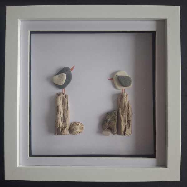 Pebble bird picture in a white shadow box frame